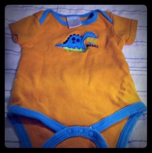 Orange Dino skateboard onesie
